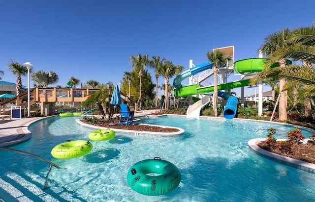 view of pool with a water slide