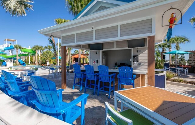 view of patio / terrace with an outdoor bar