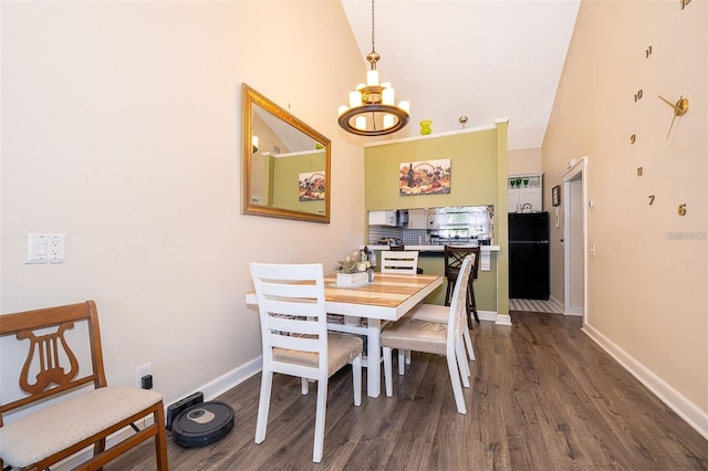 dining area featuring high vaulted ceiling, a chandelier, and dark hardwood / wood-style flooring