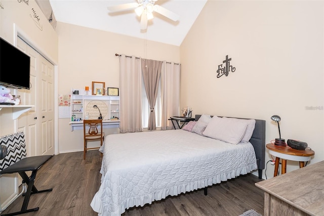 bedroom featuring dark wood-type flooring, a closet, ceiling fan, and vaulted ceiling