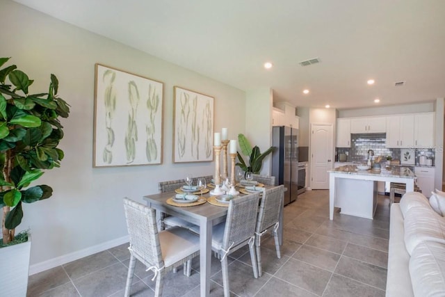 dining space with light tile patterned floors