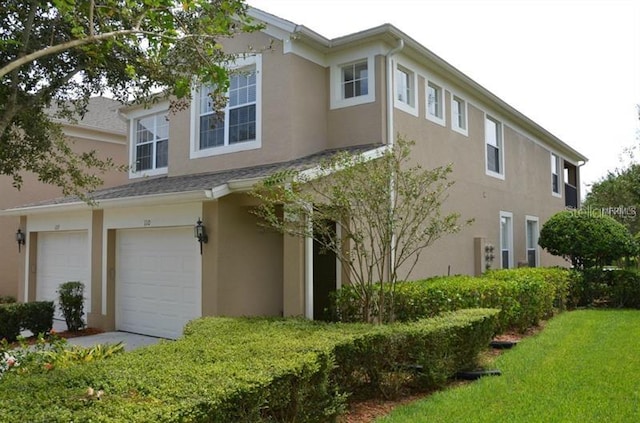 view of side of property with a garage