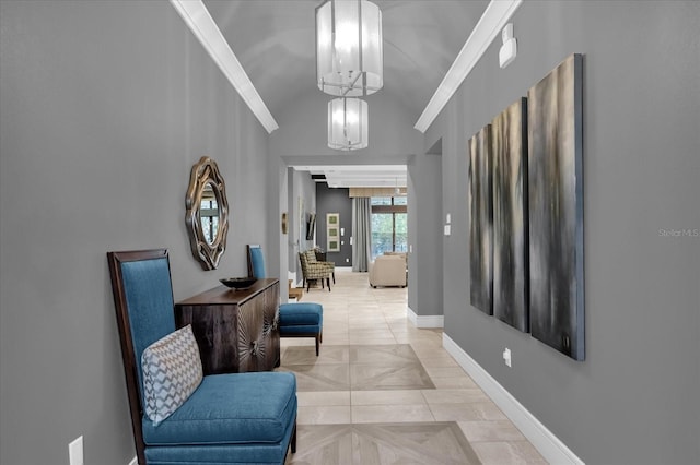 hall with crown molding, light tile patterned floors, vaulted ceiling, and a notable chandelier