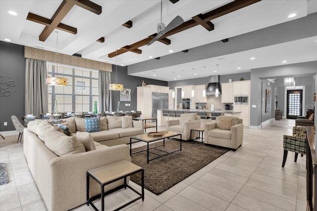 tiled living room with beamed ceiling and ceiling fan