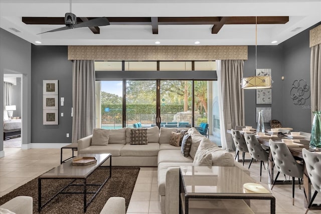 tiled living room with ceiling fan and beamed ceiling