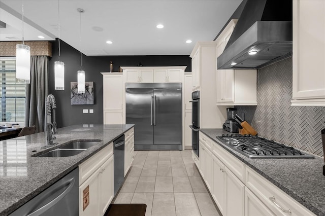 kitchen featuring backsplash, black appliances, sink, wall chimney exhaust hood, and white cabinetry