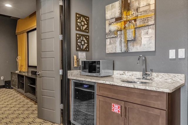 bar with beverage cooler and sink