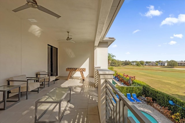 balcony featuring ceiling fan