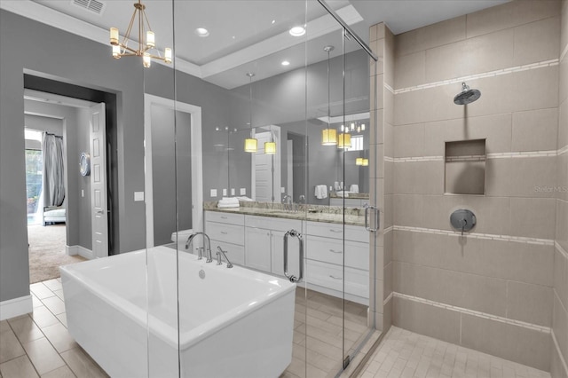 bathroom with plus walk in shower, vanity, a chandelier, and tile patterned floors