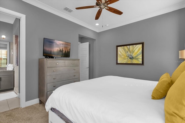 carpeted bedroom with ensuite bathroom, ceiling fan, and ornamental molding