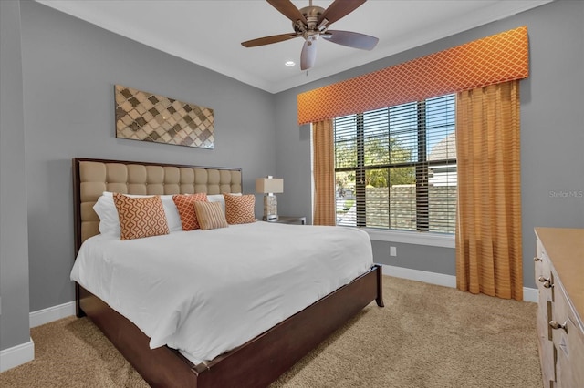 bedroom with light carpet and ceiling fan