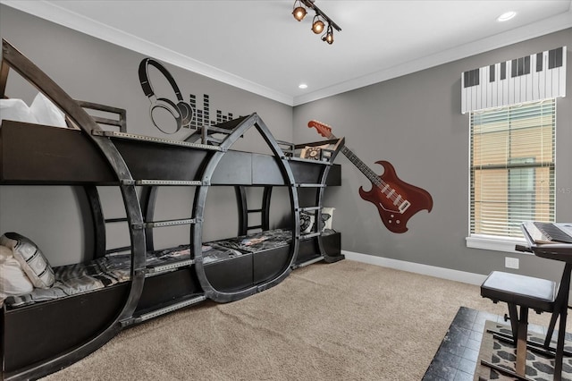 interior space with carpet flooring, rail lighting, and crown molding