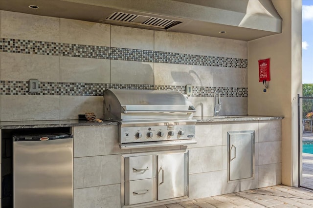 view of patio / terrace with grilling area, exterior kitchen, and sink