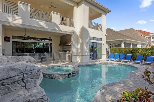 view of pool with an in ground hot tub, ceiling fan, and a patio