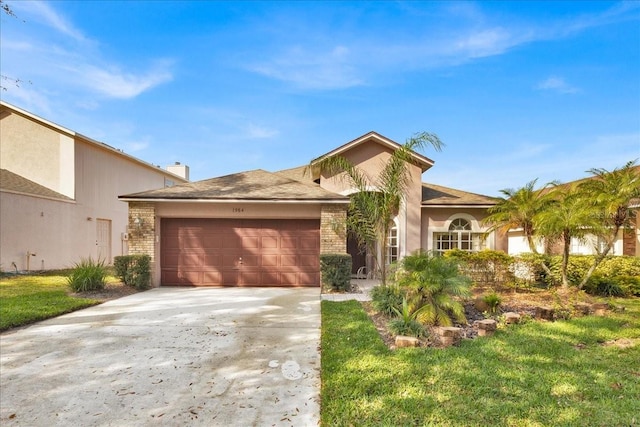 single story home with a front lawn and a garage