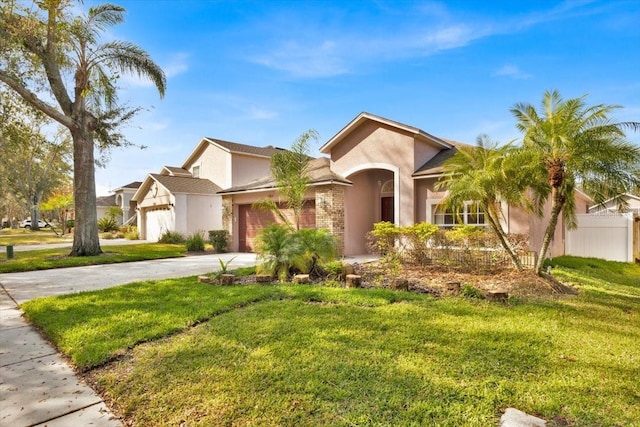 view of front of home featuring a garage and a front yard