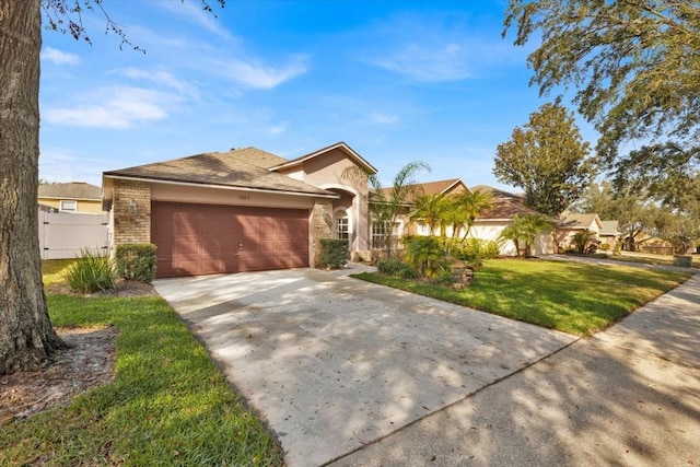 view of front of property with a garage and a front lawn