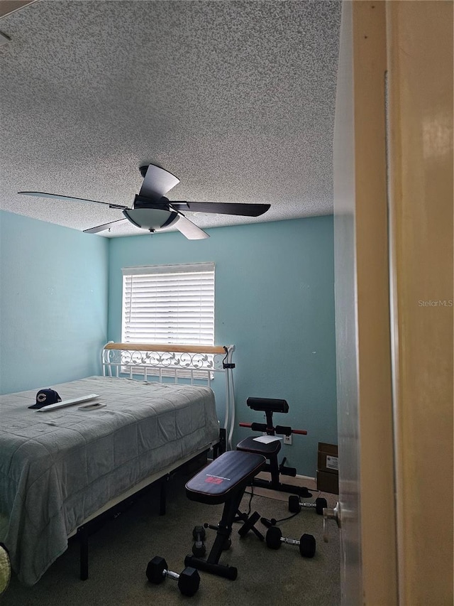 bedroom featuring a textured ceiling and ceiling fan