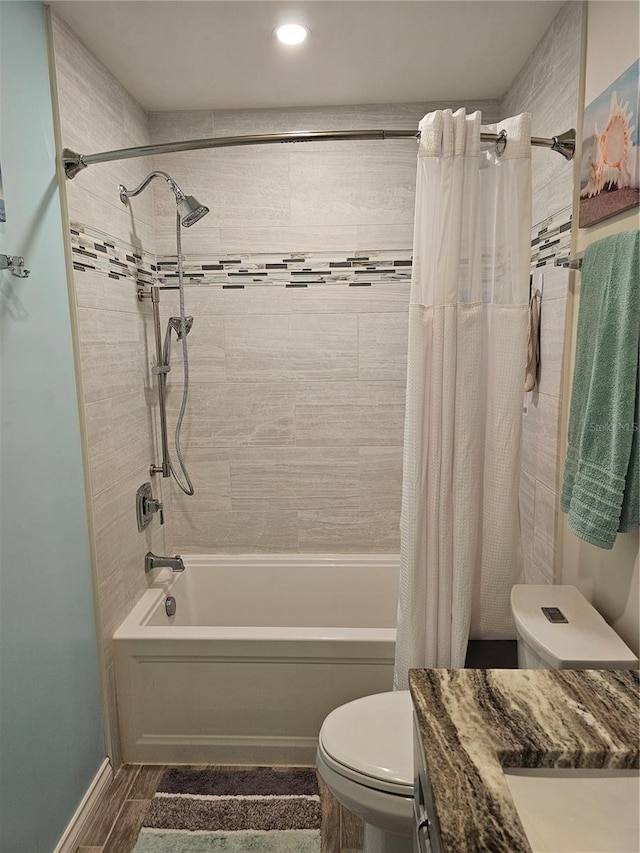 full bathroom featuring vanity, toilet, and shower / bathtub combination with curtain