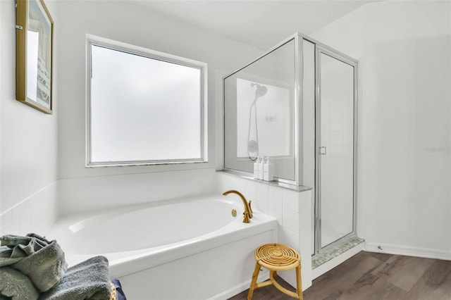 bathroom with wood-type flooring and separate shower and tub