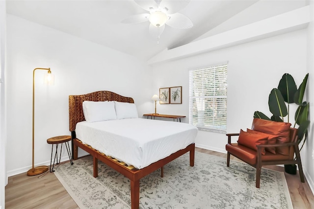 bedroom featuring vaulted ceiling, light hardwood / wood-style flooring, and ceiling fan