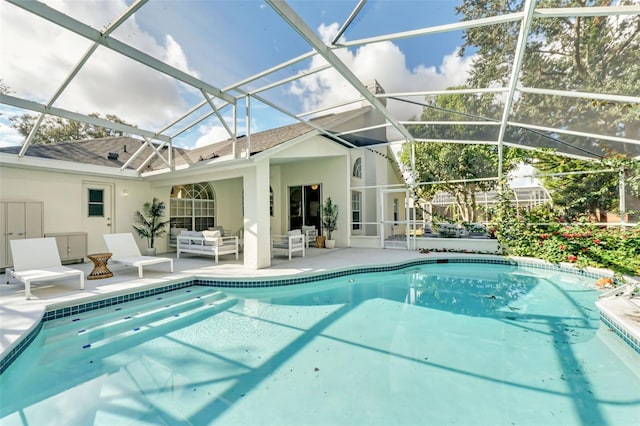 view of swimming pool with outdoor lounge area, a lanai, and a patio