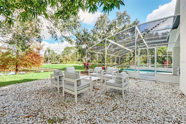 view of patio featuring glass enclosure