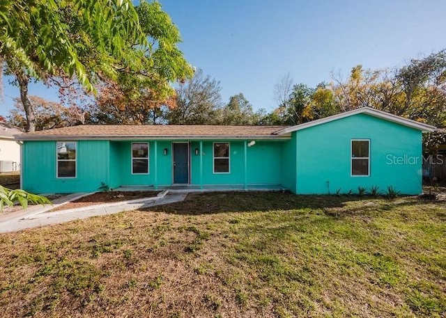 single story home featuring a front yard