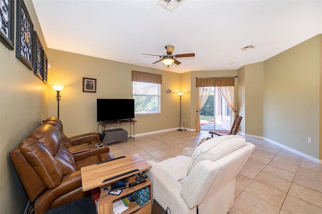 living room featuring ceiling fan and light tile patterned floors