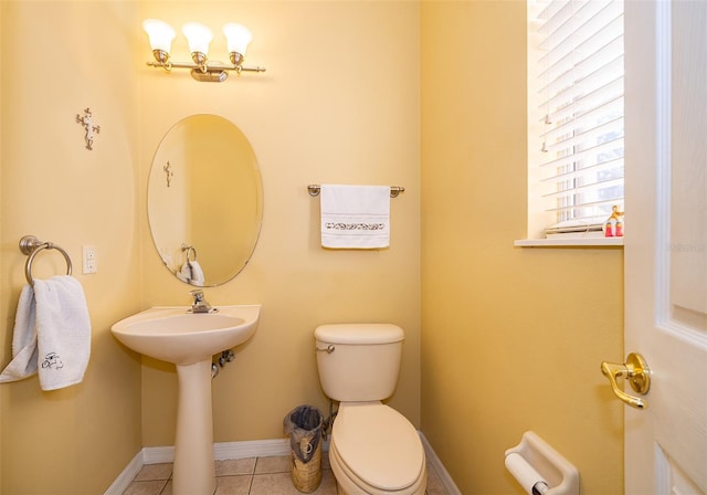 bathroom featuring toilet and tile patterned floors