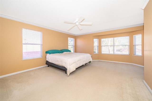 bedroom featuring light colored carpet, ceiling fan, and crown molding