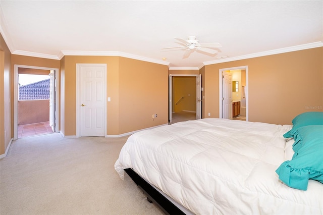 bedroom featuring ensuite bathroom, crown molding, ceiling fan, and light colored carpet