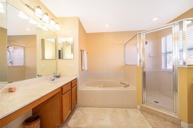 bathroom featuring tile patterned floors, vanity, and plus walk in shower