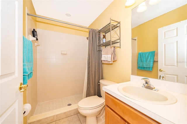 bathroom featuring tile patterned floors, walk in shower, vanity, and toilet