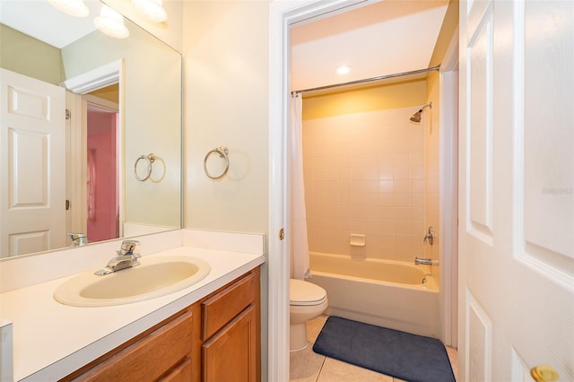 full bathroom featuring tile patterned floors, shower / bathtub combination with curtain, vanity, and toilet