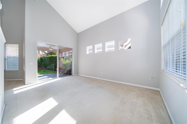 11313 Via Andiamo, Windermere, FL 34786 - spare room with high vaulted ceiling and carpet flooring