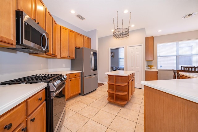11313 Via Andiamo, Windermere, FL 34786 - kitchen featuring appliances with stainless steel finishes, open shelves, light tile patterned flooring, light countertops, and a center island