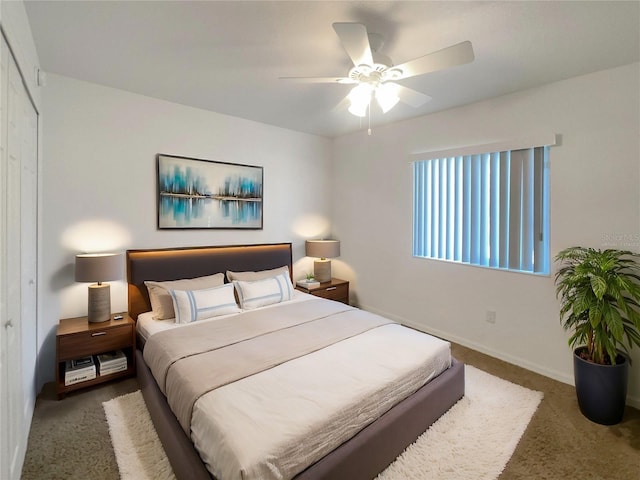 bedroom featuring carpet flooring, ceiling fan, and a closet