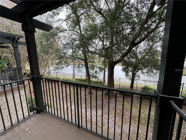 balcony featuring a water view