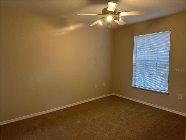 empty room with carpet flooring and ceiling fan