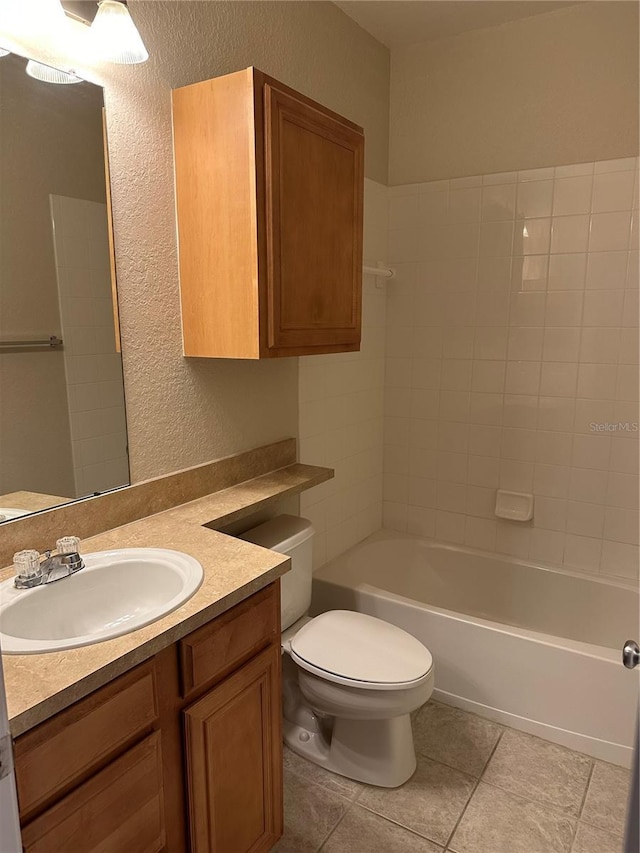 full bathroom with tile patterned floors, bathing tub / shower combination, vanity, and toilet