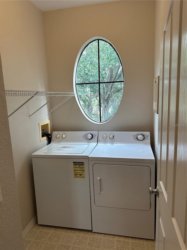 laundry room with washer and dryer