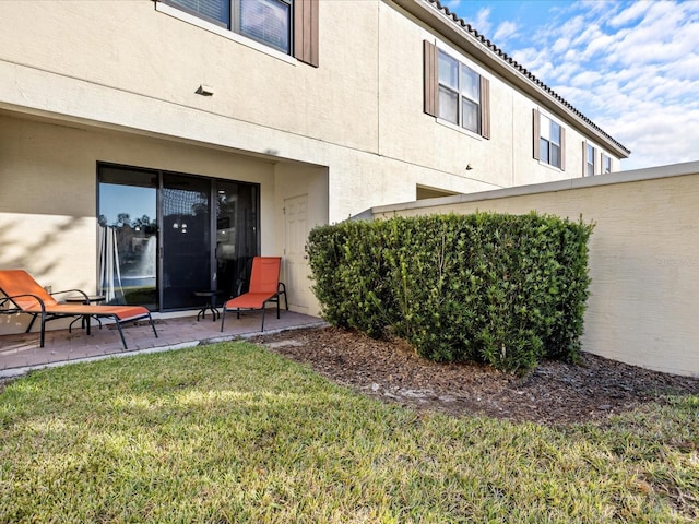 exterior space with a yard and a patio area