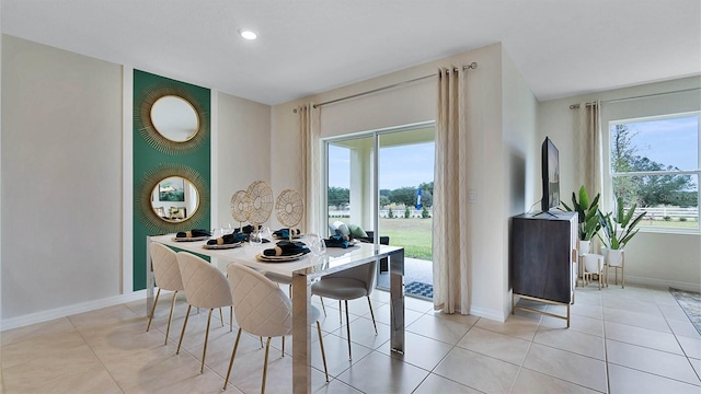 dining area featuring light tile patterned floors