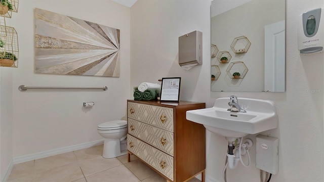 bathroom featuring tile patterned flooring and toilet