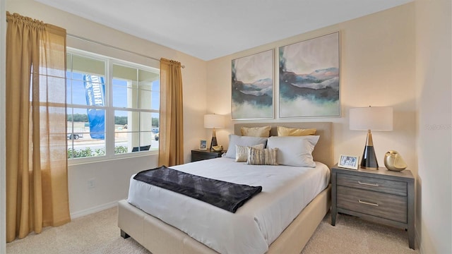 carpeted bedroom featuring multiple windows