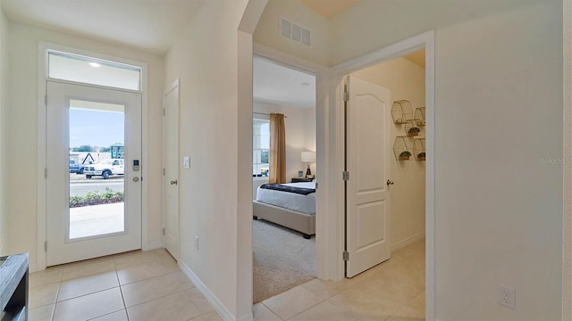 foyer entrance featuring light tile patterned floors