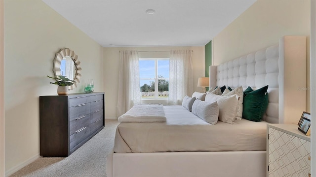 bedroom with light colored carpet