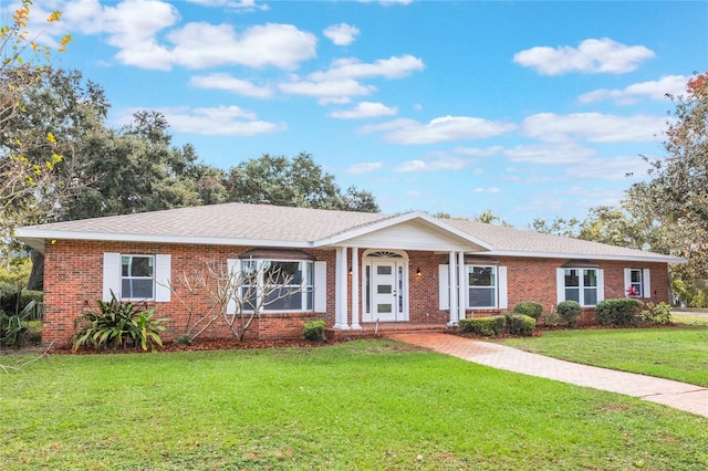 ranch-style home featuring a front yard