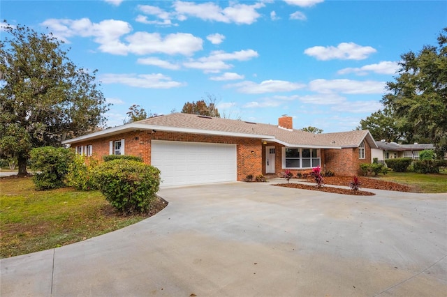 ranch-style house featuring a garage